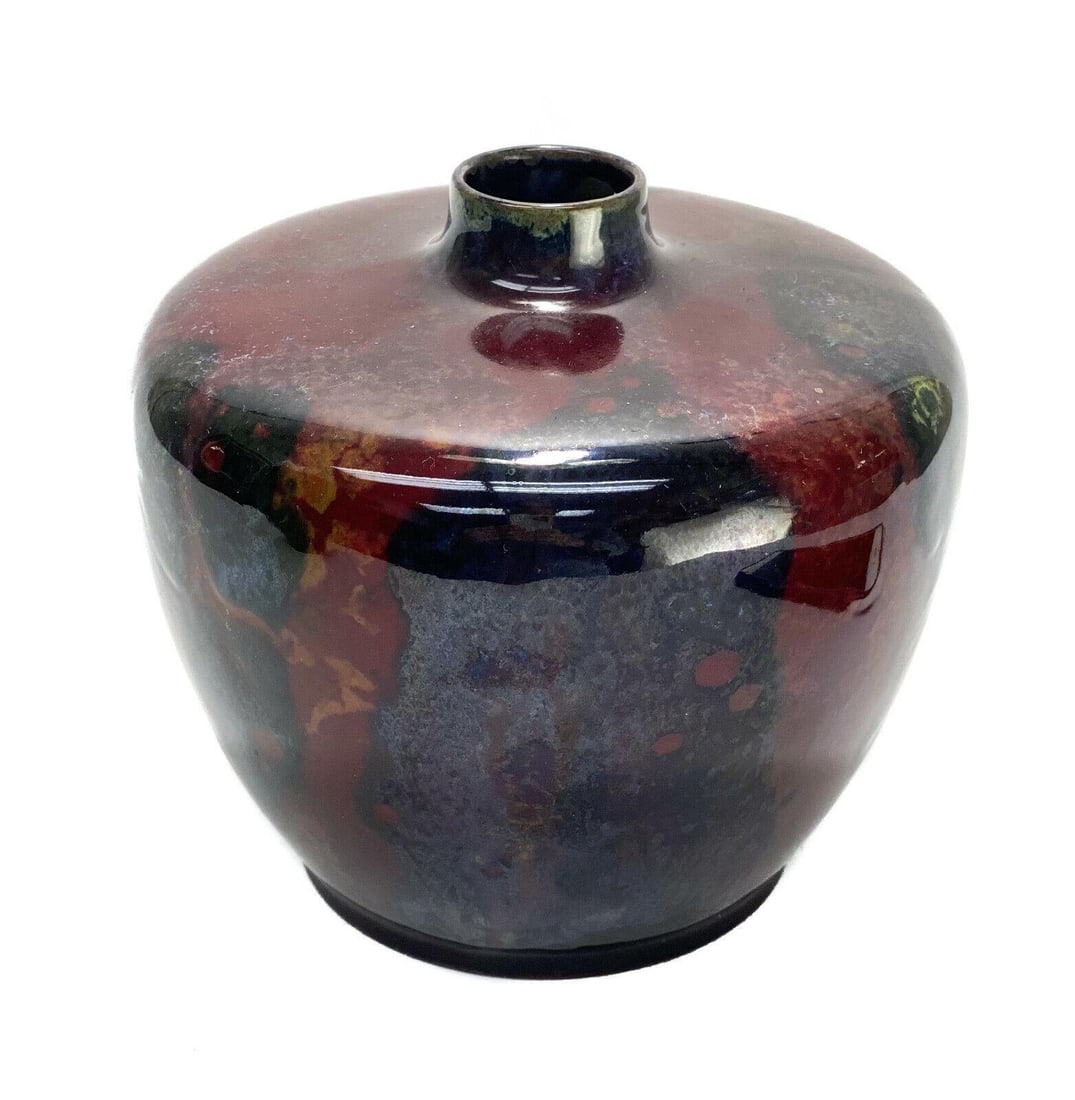 Royal Doulton Porcelain Sung Ware Noke Flambe Vase: Royal Doulton porcelain Sung Ware Charles Noke Flambe vase by Fred Allen, Early 20th Century. A wine red ground with dark blue and yellow hues throughout. Artist signed, "F. Allen" towards the base. M