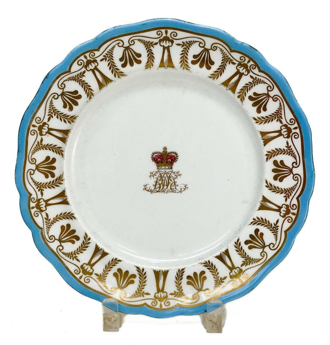 Chamberlain & Co. Hand Painted Porcelain Plate: Chamberlain & Co. England hand painted porcelain plate, circa 1820. Sky blue rim with gilt floral pattern to edge. Center depicts a hand painted red crown with royal monogram. Chamberlain & Co. marks