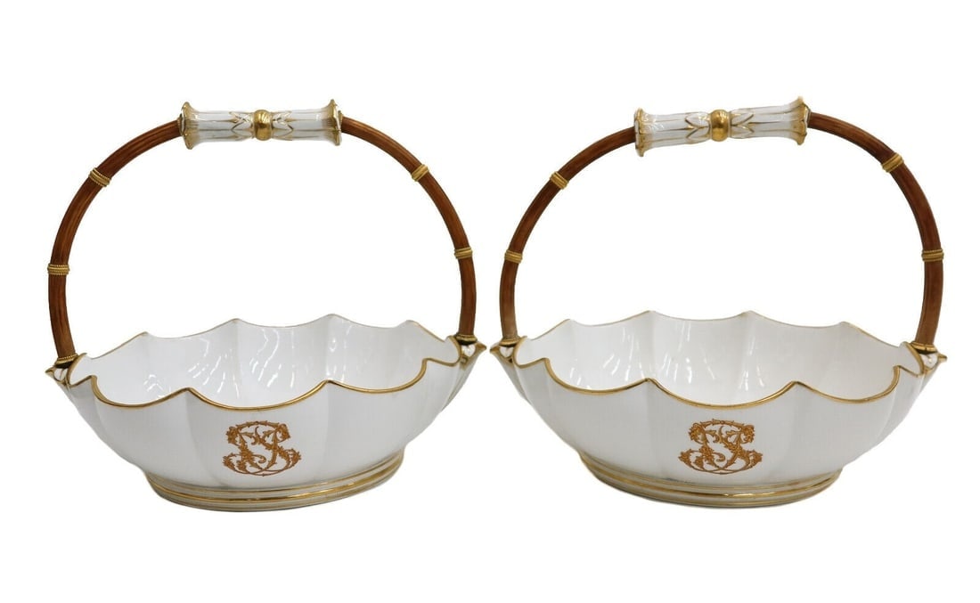 Pair Manufacture Sevres Handled Baskets Melonneire a Cotes 2e Grandeur 1859: Pair Manufacture de Sevres Gilt Porcelain Baskets Melonneire a Cotes 2e grandeur. White porcelain scalloped bowl, gilt stylized monogram to the side. Rattan wood handle. Underside with Sevres mark 59,