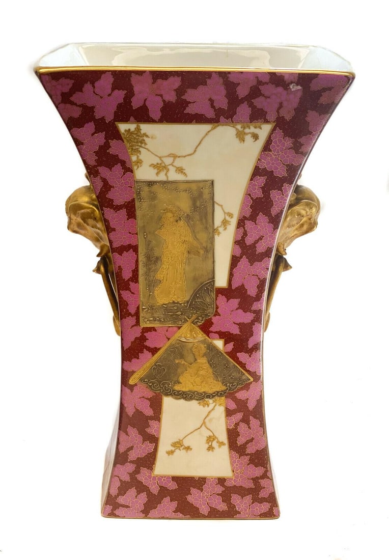 Continental Porcelain Japonism Vase: Continental Porcelain Japonism hand painted & gilt encrusted twin handle vase, circa 1900. Multi-colored raised gold decorated Japanese figures to the central area with leaf accents to the red and pin