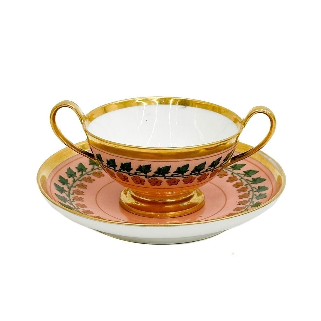 Manufacture de Sevres Porcelain Two handled Cup and Saucer Pink c. 1814-24: Manufacture de Sevres Porcelain Two handled Cup and Saucer, circa 1814-24. A pink ground decorated with painted flowers and leaves, gilt accents. Underside with various incised marks, underside of sau