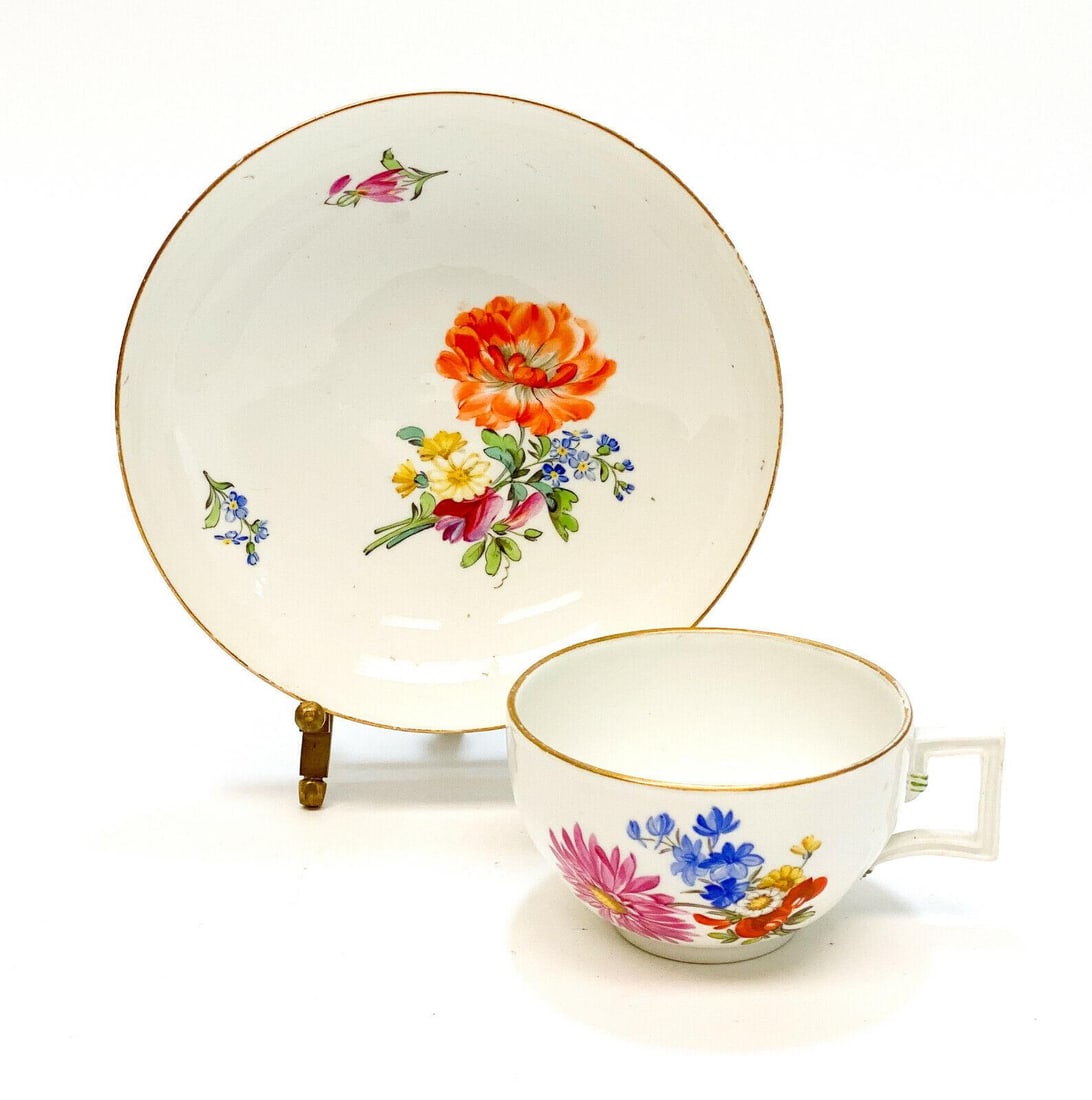 Meissen Marcolini Germany Hand Painted Porcelain Cup & Saucer, Orange Flower: Meissen Marcolini hand painted porcelain cup & saucer. Hand painted orange, pink, blue, and yellow flowers. Meissen mark to the underside. Weight Approx., 1lb Measures approx., Cup: 3.9 inches x 3.625