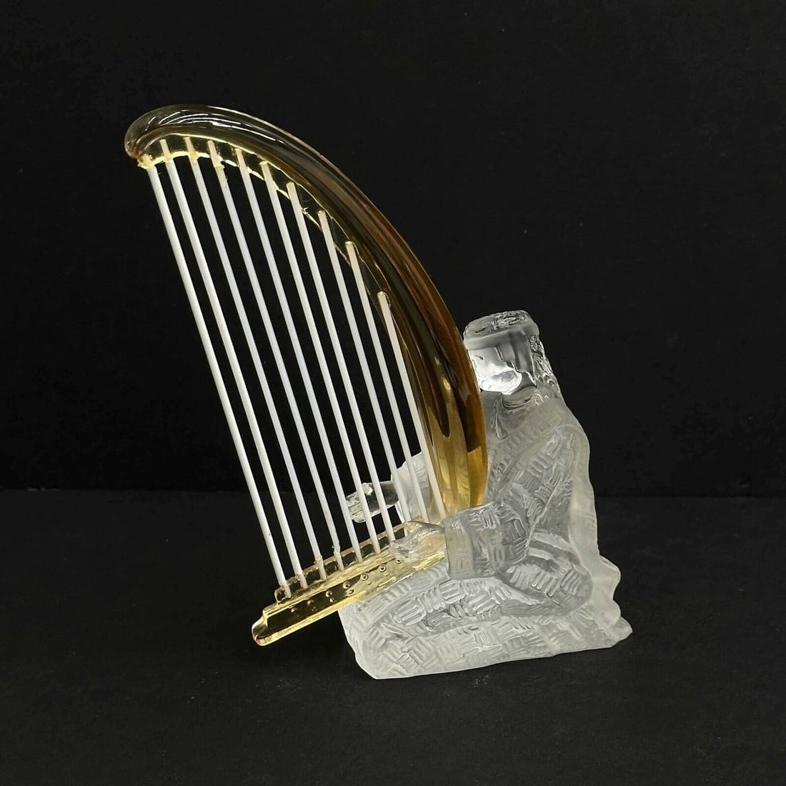Saint St Louis France Crystal Art Glass Musician Figurine Harp Player: Saint St Louis France Art Glass Musician Figurine. Frosted glass figurine depicts a seated figure playing an amber colored glass harp. Polished pontil to the underside, inscribed Saint LouisWeight: Ap