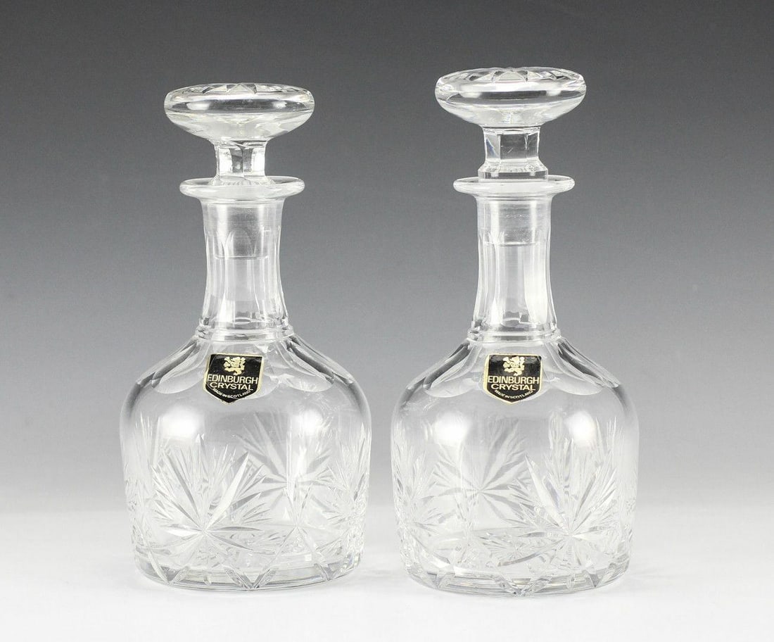 Pair Star of Edinburgh Crystal Decanters. Original Labels: Pair Star of Edinburgh Crystal Decanters. Original labels. Measures Approx., 6.625 inches height Domestic Shipping: $50