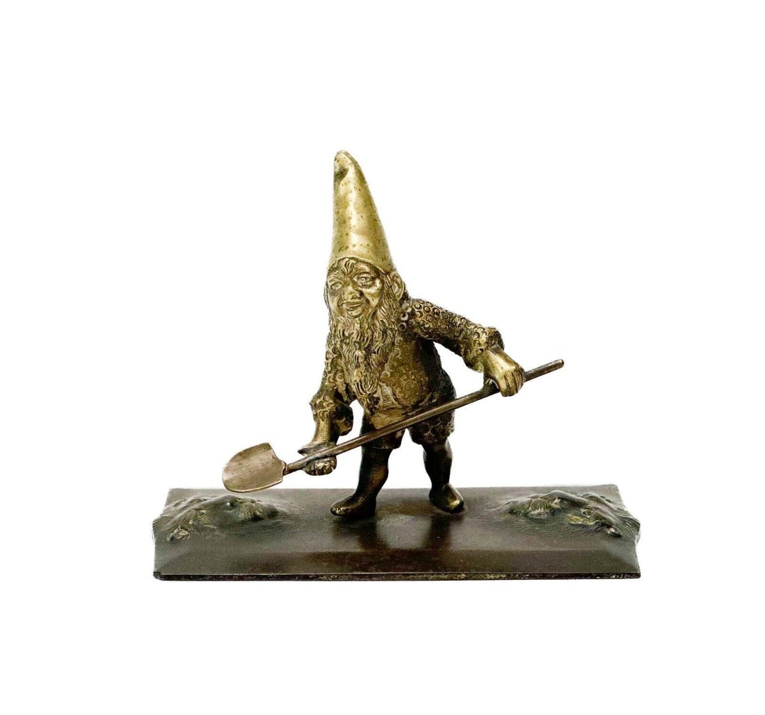 Austrian Gilt and Patinated Bronze Figural Sculpture Gnome c. 1900: Possibly Austrian gilt and patinated bronze figural sculpture of a gnome, circa 1900. Gilt bronze figural gnome holding a shovel, base with lion faces. Weight approx., 2 lbs Measures Approx., 5.75 in