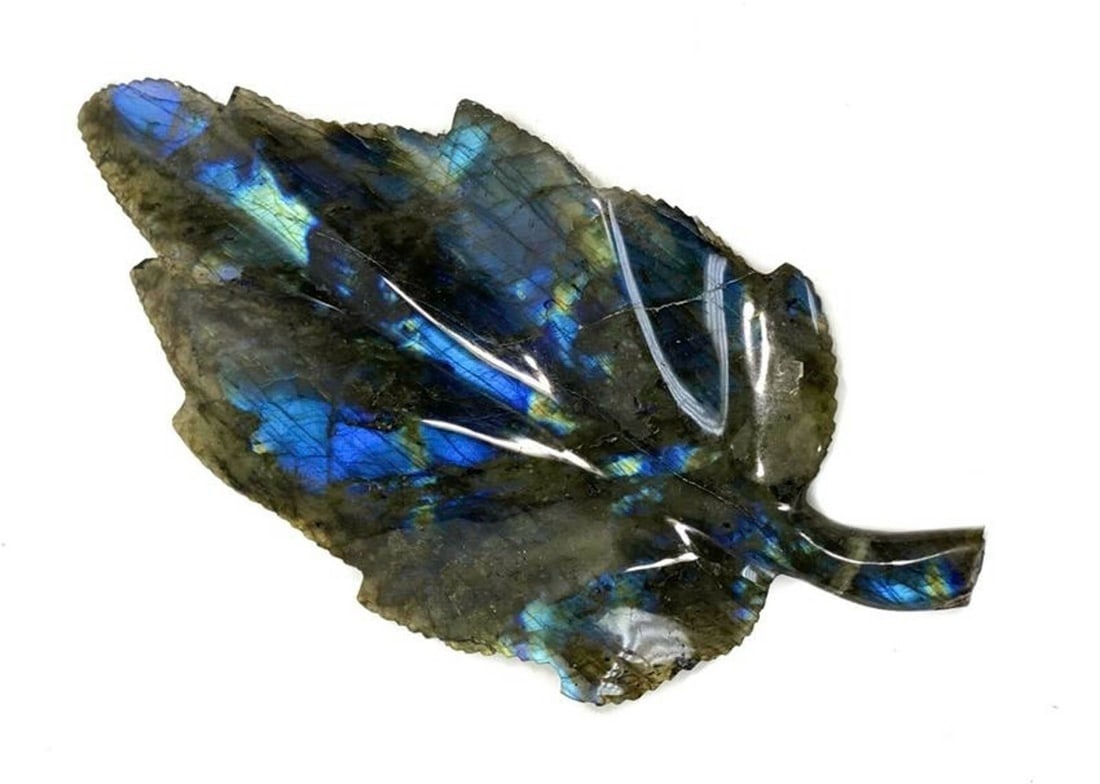 Iridescent Hand Carved Labradorite Leaf Figure: Iridescent Hand Carved Labradorite Leaf Figure. Iridescent hand carved labradorite stone leaf figure. Iridescent blue to the stone. Unmarked. Weight: Approx. 1 lb Measurements: approx. 5.25 inches x 1
