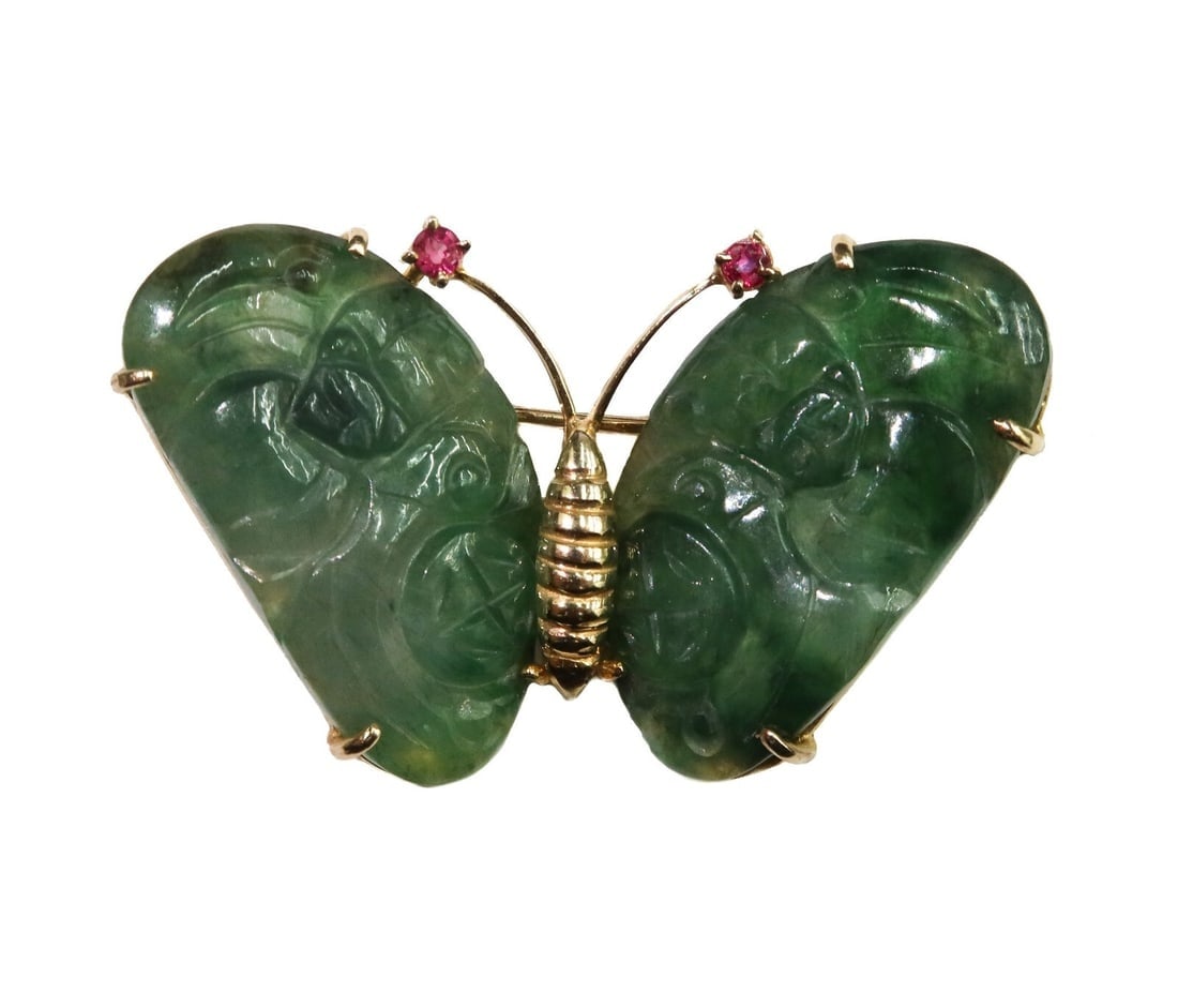 Gump's 14k Yellow Gold Carved Jade and Ruby Butterfly Brooch Pin: Gump's 14k yellow gold carved jade and ruby butterfly brooch pin. Carved jade in an abstract pattern to wings with ruby antennas measuring approximately 2.3mm diameter x 1.3mm and weighing approximate