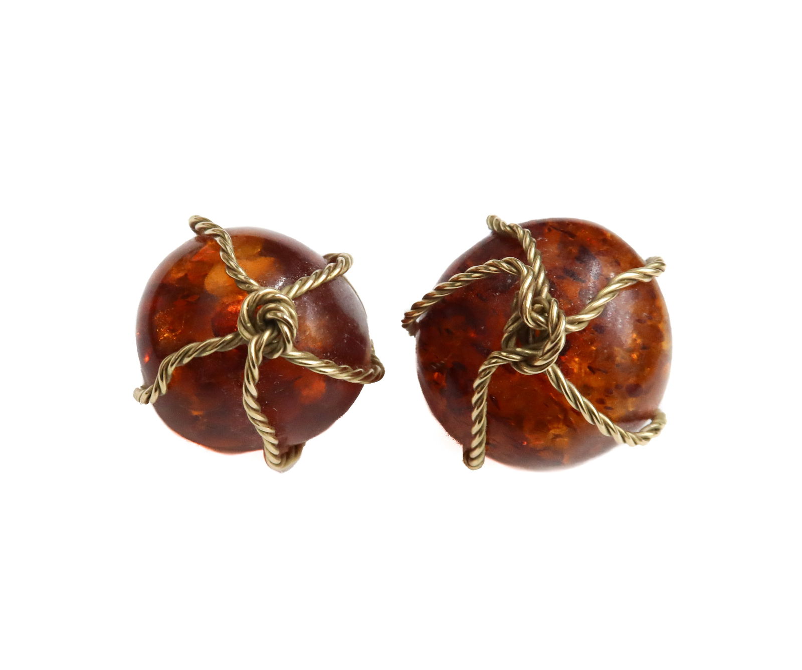 14k Yellow Gold and Dome Amber Clip Earrings: 14k Yellow Gold and Dome Amber Clip Earrings. Dome Amber jewels to center with gold wirework roped wrapping around the jewel. Marked 14k gold. Weight Approx., 16.73 grams Measures Approx., 1 inch diam