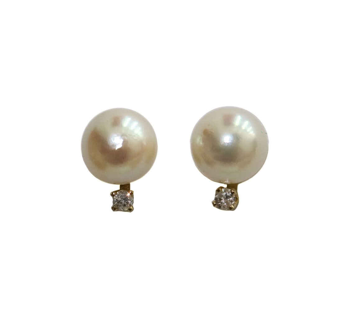 14k Yellow Gold Cultured Pearl and Diamond Earrings: 14k Yellow Gold Cultured Pearl and Diamond Earrings. Cultured pearl measuring approximately 7.1mm. Marked diamond weighing approximately 0.04 carats. Marked 14k to back. Weight Approx., 1.41 grams Mea