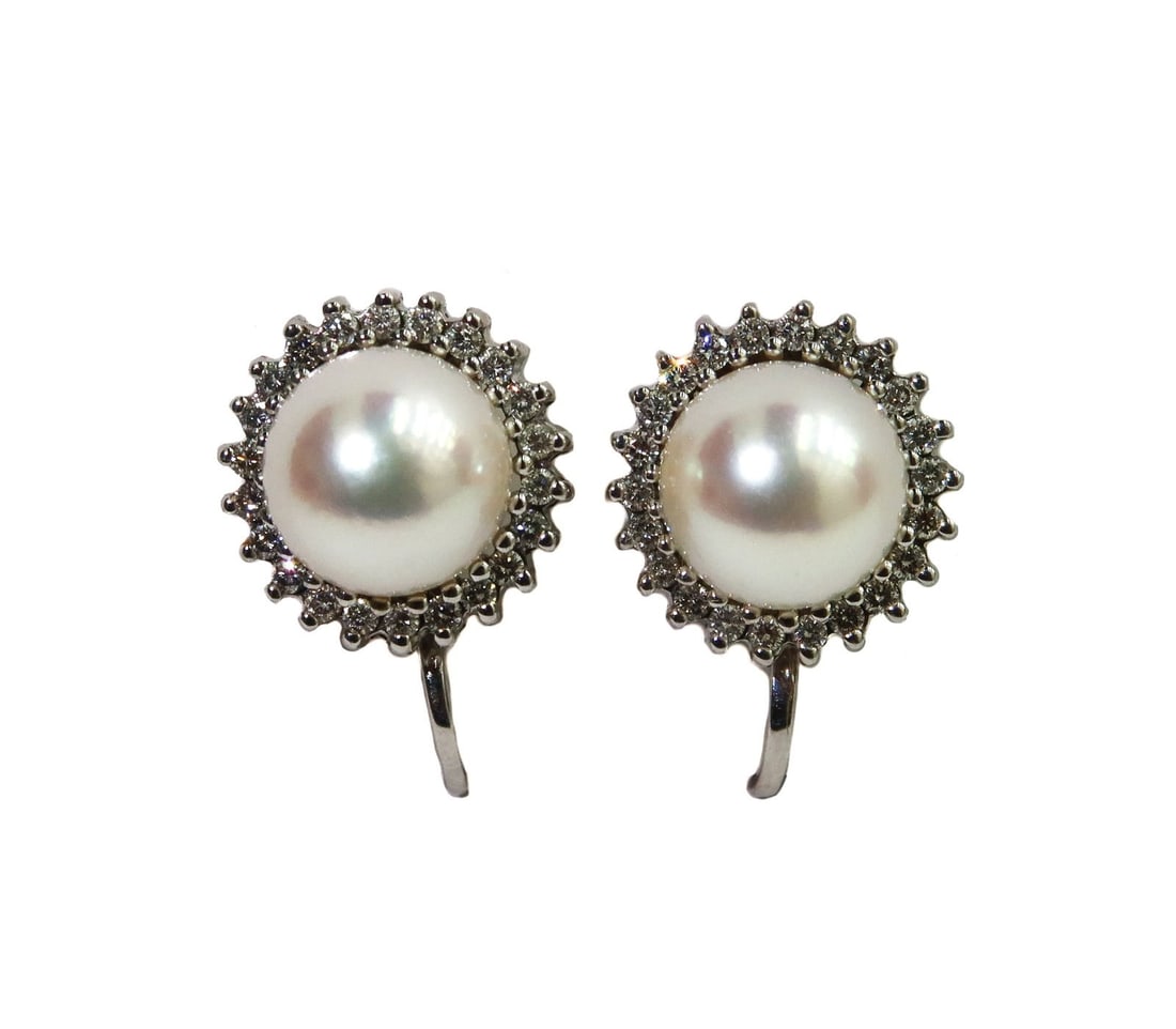 14k White Gold Cultured Pearl and Diamond Twist Back Earrings: 14k White Gold Cultured Pearl and Diamond Twist Back Earrings. Cultured pearl center measuring approx 7.4mm. 22 round cut diamonds to the frame of each pearl weighing approximately 0.44 carats total.