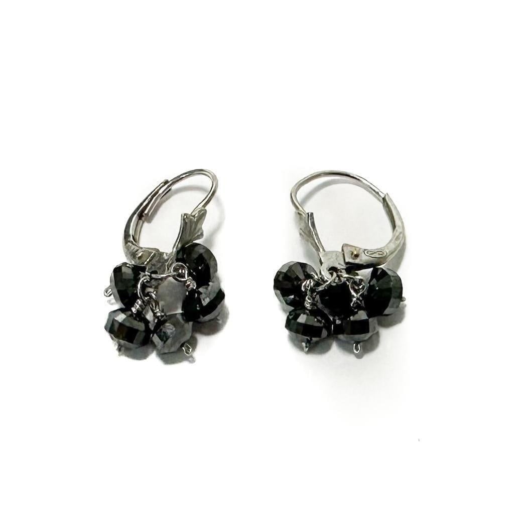 Platinum Hematite Earrings: .950 Platinum Hematite Earrings. .950 platinum silver hooks with hematite jewels. Marked "950 PT" to hook. Weight Approx., 2.85 grams Measures Approx., 0.75 inches length Domestic Shipping: $25