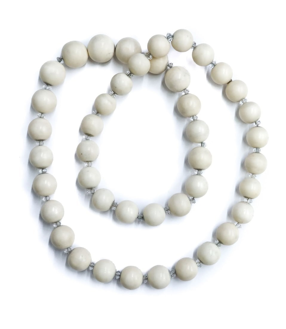 Large Angel Skin Coral and Clear Quartz Graduated Beaded Necklace: Angel Skin Coral and Clear Quartz Graduated Beaded Necklace. Graduated angel skin coral beads measuring from 15.8mm to 18.8mm. Clear quartz spacers. Weight Approx., 249 grams Measures Approx., 30 inch