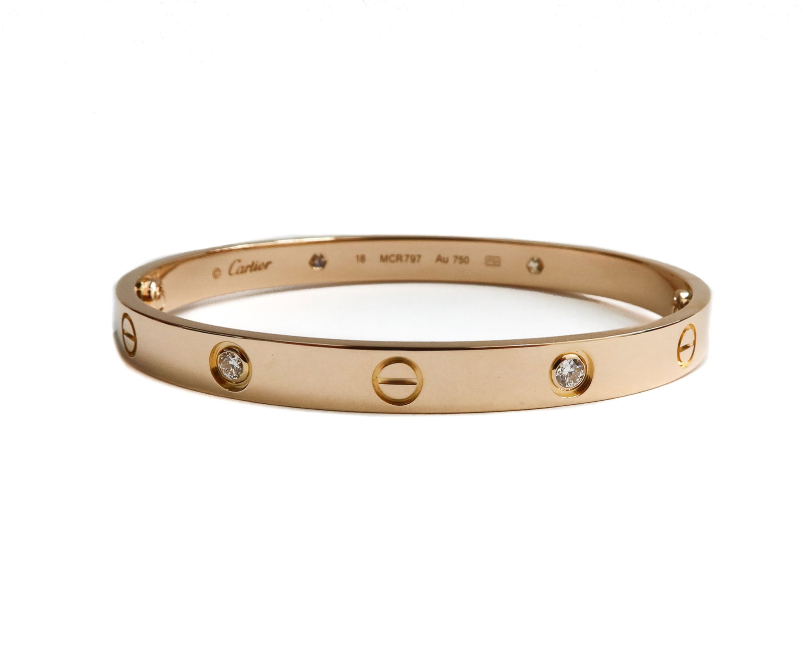 Cartier 18k Classic Pink Gold and 4 Diamond Love Bracelet 18cm: Cartier 18k Classic Pink Gold and 4 Diamond Love Bracelet 18cm. 4 round cut diamonds weighing approximately 0.42 carats. Double screw hinge. Cartier 18k marks to interior. With original screwdriver, b