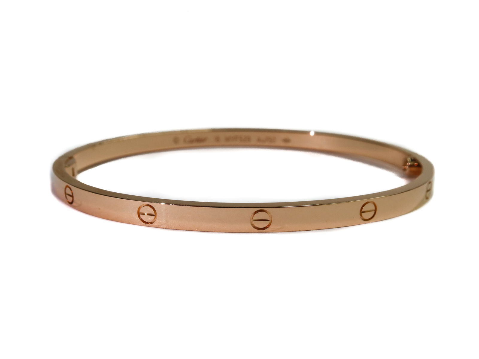 Cartier 18k Small Pink Gold Love Bracelet 18cm: Cartier 18k Small Pink Gold Love Bracelet 18cm. Single Screw Hinge. Cartier 18k marks to interior. With original screwdriver, box, certificate of authentification, bag, and purchase reciept. Weight Ap