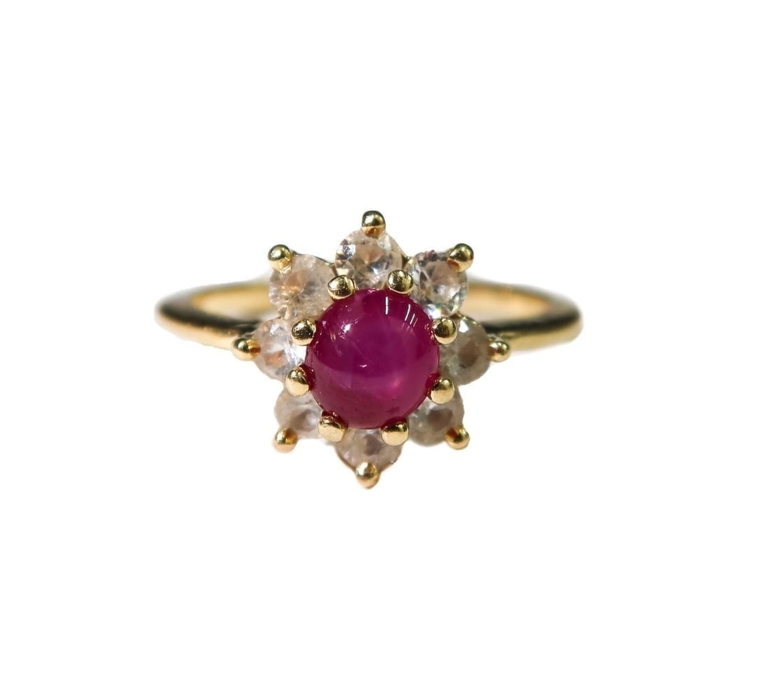14k Yellow Gold Star Ruby and White Topaz Ring Size 8.5: 14k Yellow Gold Star Ruby and White Topaz Ring Size 8.5. Cabochon cut to center with round cut white topaz in a petal form. Marked 14k Weight Approx., 3.74 grams Size 8.5 Domestic Shipping:$25