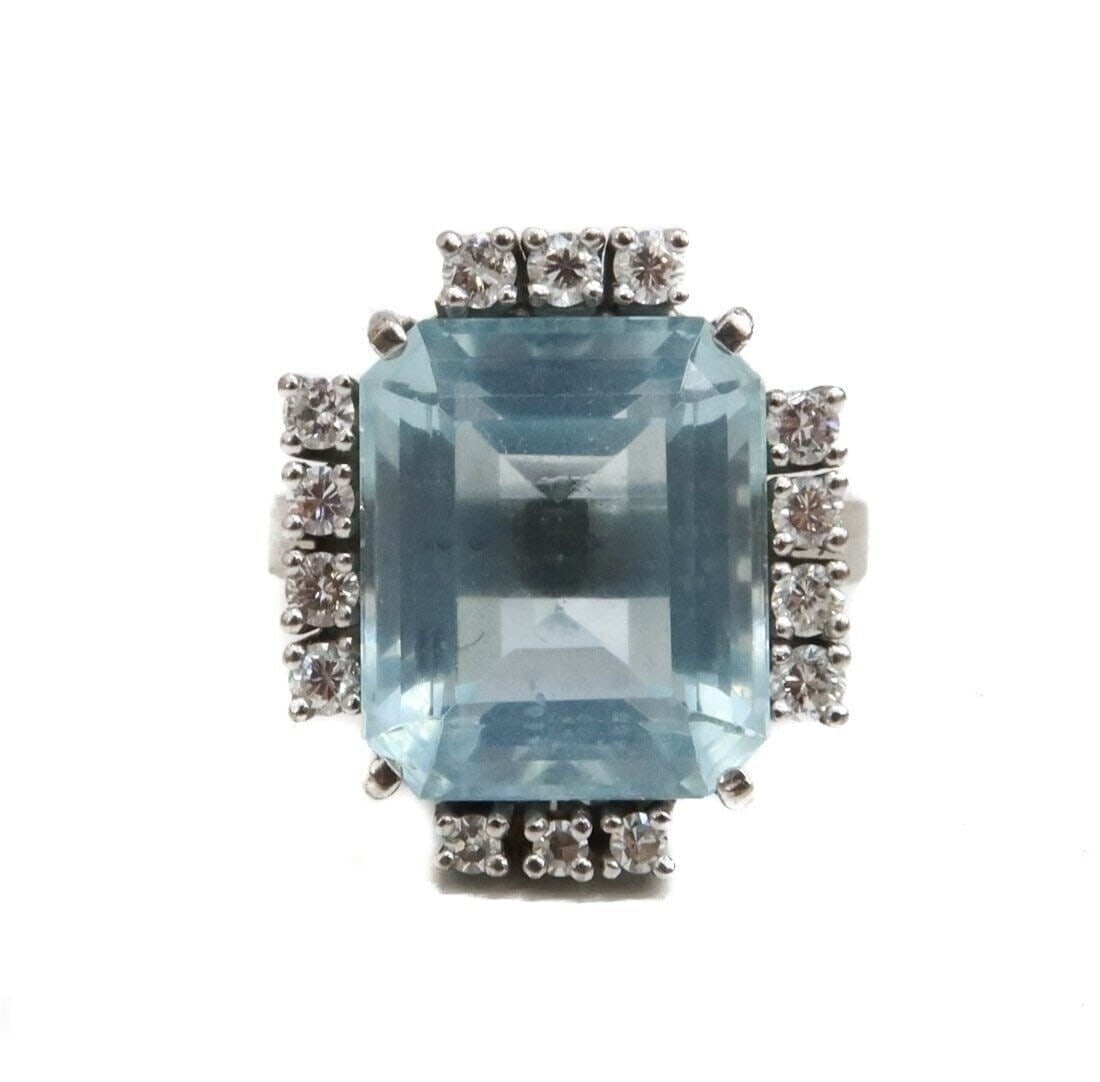 14k White Gold Aquamarine and Diamond Ring, Size 5.5: 14k White Gold Aquamarine and Diamond Ring, Size 5.5. Rectangular step cut aquarmarine center weighing approximately 7 carats. 14 brilliant round cut diamonds to the frame weighing approximately 0.55