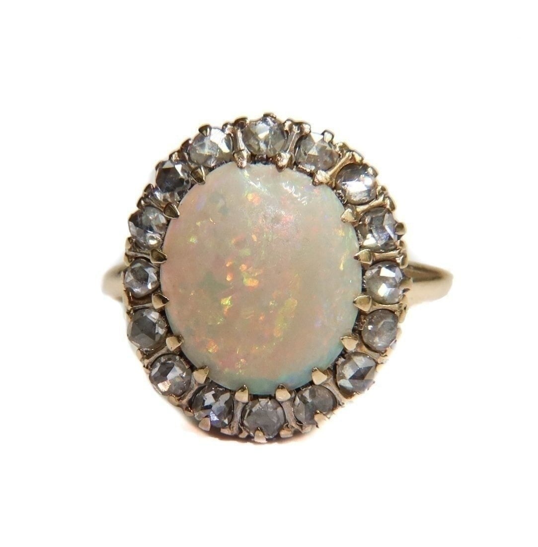 14k Yellow Gold White Opal and Diamond Ring: Antique 14k Yellow Gold White Opal and Diamond Ring, Size 6. Cabochon white opal center with 16 old mind cut diamonds weighing approximately 0.4 carats. Marked "14k" to inner band and maker mark "LR".