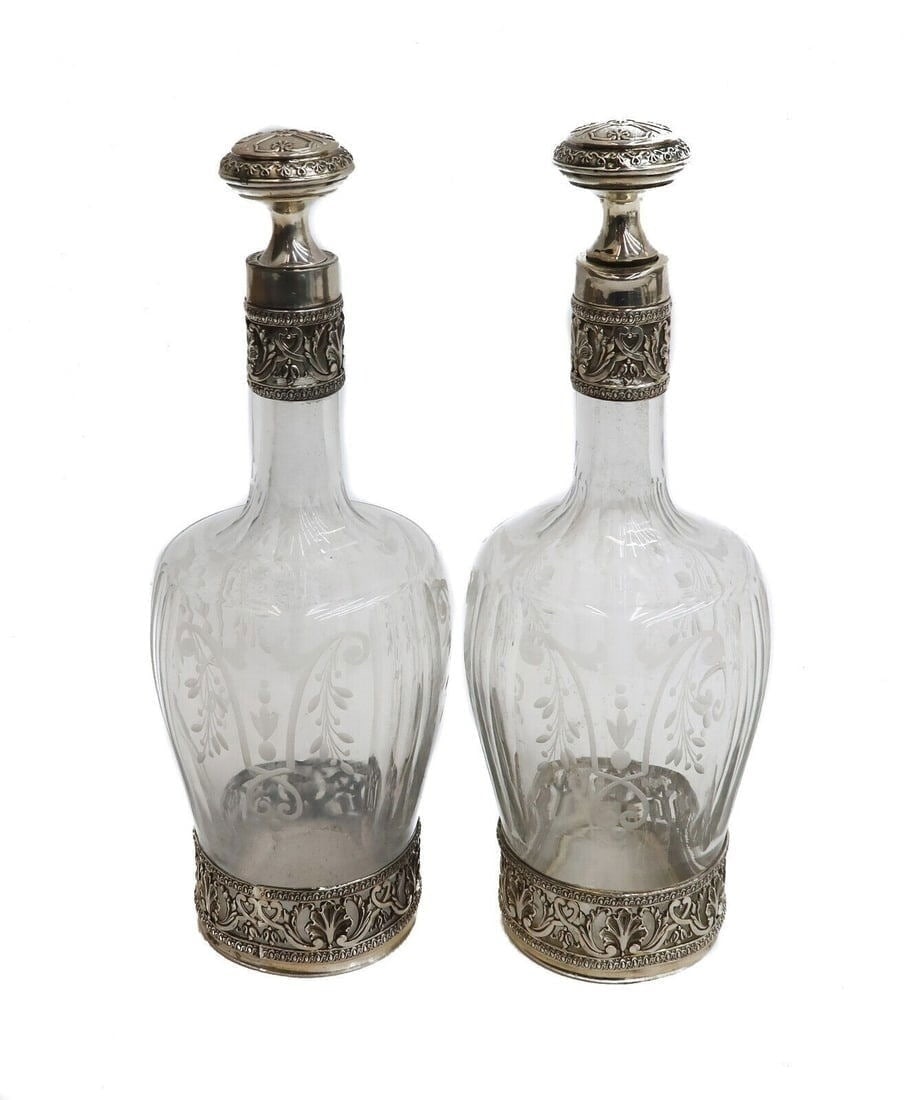 Pair French Silver and Acid Etched Glass Decanters, circa 1900. Etched Leaves: Pair French silver and acid etched glass decanters, circa 1900. Etched leaves throughout the body with foliate scrolls to the silver overlay areas. French silver minerva mark to neck. Weight: Approx.