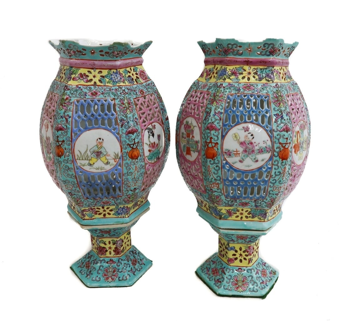 Pair Chinese Qianlong Reign Porcelain Famille Rose Reticulated Lanterns 19th C: Pair Chinese Qianlong Reign porcelain Famille Rose lanterns, Late 19th Century. Reticulated body with hand painted enamel floral decorations. Alternating hand painted figures and birds to each panel.