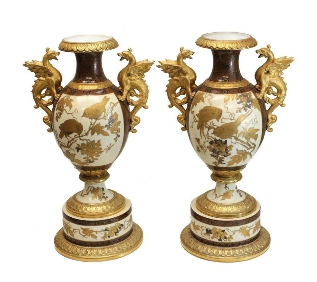 Pair Pirkenhammer Porcelain Aesthetic Dragon Vases: Pair Pirkenhammer porcelain Aesthetic gold encrusted double handled footed vase, circa 1880. The central image of the urns depict gold encrusted birds perched on tree branches with more tree branches
