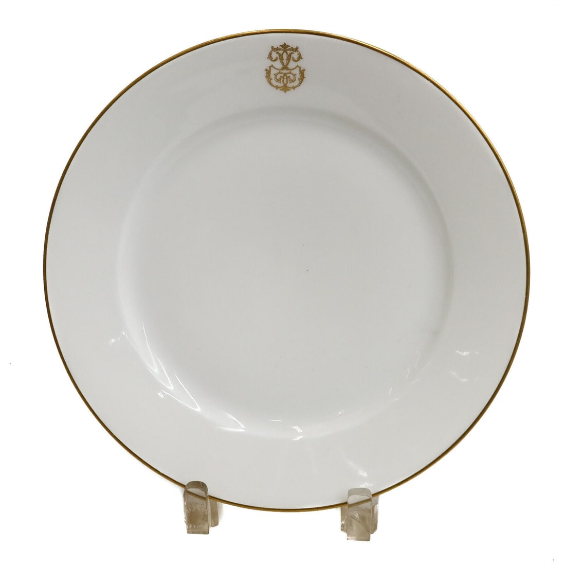 Manufacture de Sevres Porcelain Gilt Emblem Dessert Plate, 1895: Manufacture de Sevres porcelain gilt emblem dessert plate, 1895. Gilt rim with an emblem to top center. Manufacture de Sevres mark to underside. Weight: Approx. 1 lb Measurements: Approx.9.6 inches di