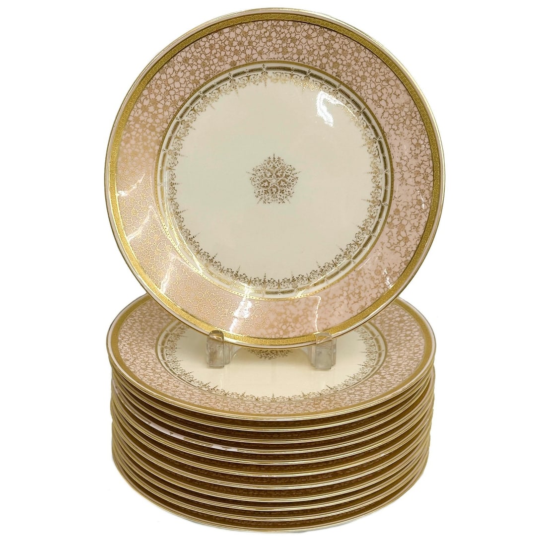 12 Cauldon TC Brown Westhead Moore & Co England Porcelain Dinner Plates c1880: 12 Cauldon Ware TC Brown Westhead Moore & Co England Porcelain Dinner Plates, circa 1880. A light pink ground to the edge with ornate gilt decoration. Underside marked Cauldon Ware TC Brown Westhead M