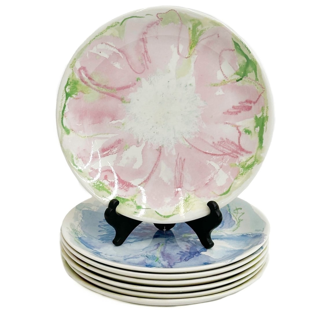 7 Tiffany & Co Porcelain Plates in Tiffany Blossom Pink Blue Orange Yellow: 7 Tiffany & Co Porcelain Plates in Tiffany Blossom. Plates each with colorful flower to the center. Underside marked Tiffany Blossom. Weight: Approx. 6.5 lbs Measurements: Approx. 8.5 inches diameter
