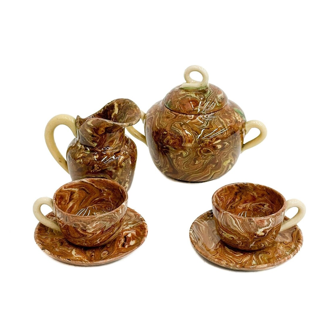 English Agate Ware Porcelain Demitasse Cream Sugar Cup Saucers 19th century: English Agate Ware Porcelain Demitasse Cream Sugar Cup Saucers, 19th century. Includes Creamer, lidded sugar bowl, pair of cups and saucers. Weight: Approx. 1 lb Measurements: Approx. Creamer: 3 inche