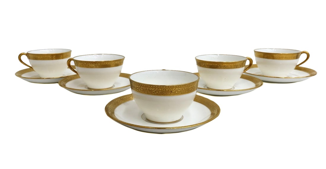 5 Lenox for Tiffany & Co Porcelain Gilt Rimmed Cup and Saucers circa 1920: 5 Lenox for Tiffany & Co porcelain and gilt rimmed cup and saucers, circa 1920. Gilt ribbons and scrolls to rim. Weight: Approx. 6 lbs Measurements: Approx. Cup: 4.25 inches x 3.5 inches x 2.25 inches