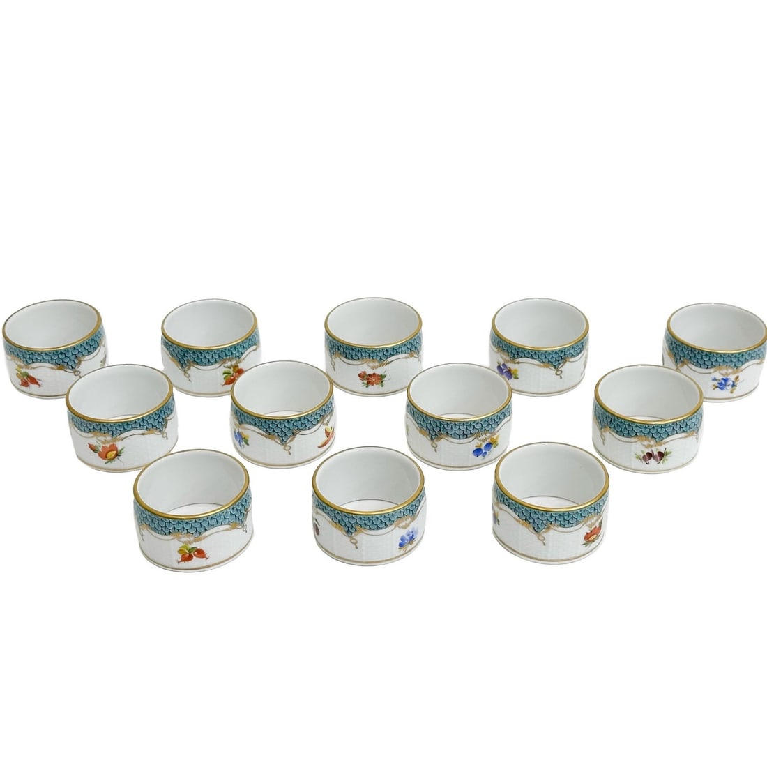 12 Herend Hungary Fruits Turquoise Fish Scale Porcelain Napkin Rings 270: 12 Herend Hungary Fruits Turquoise Fish Scale Napkin Rings 270. Turquoise blue scale design to edge with hand painted fruits and flowers to center. Herend Hungary mark to interior. Weight: Approx. 1 l