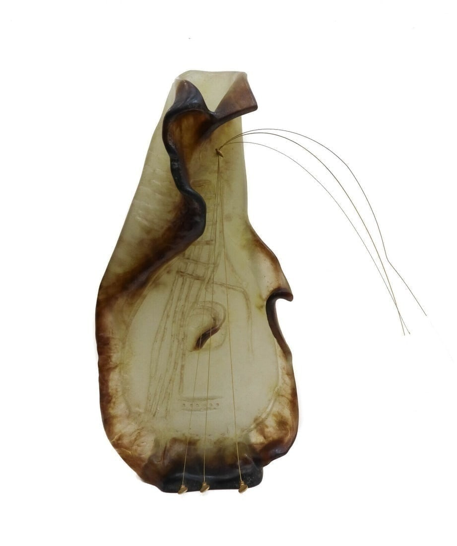 Daum Pate De Verre Art Glass Sculpture- Guitar by Salvador Dali: A large Daum France pate-de-verre sculpture of a guitar by surrealist artist Salvador Dali. Semi-translucent with green and amethyst hues with gilt-metal keys and strings. Marked "Dali" to one edge an
