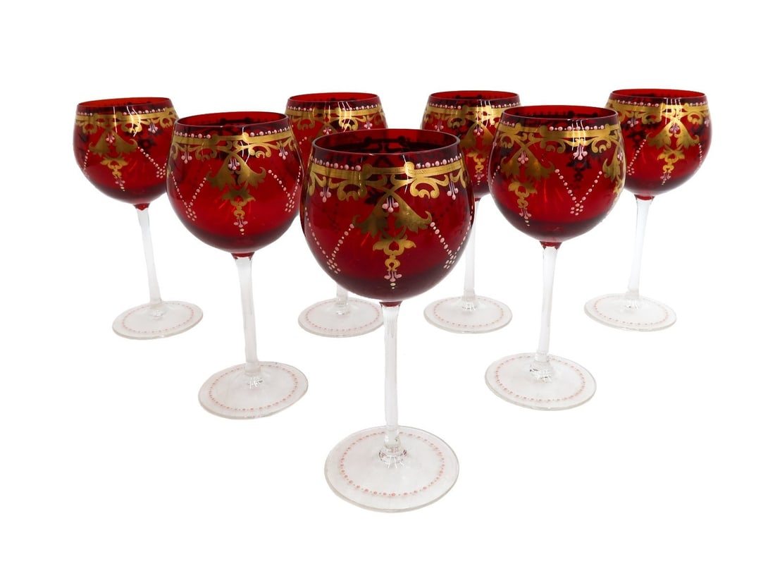 7 Venetian Cranberry Red and Clear Gilt and Enamel Wine Goblets circa 1950: 7 Venetian cranberry red and clear gilt and enamel wine goblets circa 1950. Cranberry red to bowl with clear stems and bases. Gilt foliate swags with pink enamel decoration. Weight: Approx. 1 lbs Meas