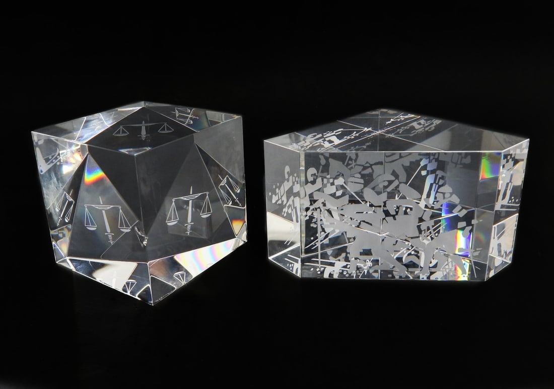 Two Steuben Art Glass Paperweights- Scales of Justice and Skiing Crystal: Two Steuben art glass paperweights- "Scales of Justice" by Paul Schulze and "Skiing Crystal" by Bernard X. Wolff. Both signed Steuben to underside. Weight: Approx. 5 lb Measurements: Approx. Skiing Cr