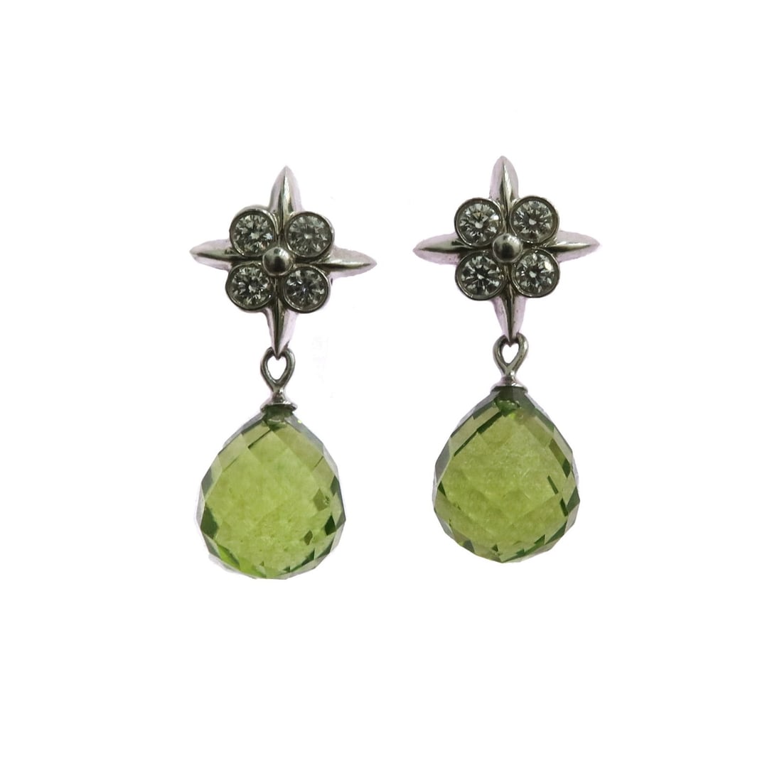 Tiffany & Co. 950 Platinum Diamond and Briolette Cut Peridot Drop Earrings: Tiffany & Co. Platinum Diamond and Briolette Cut Peridot Drop Earrings. 8 round cut diamonds to the floral shaped studs weighing approximately 0.4 carats. Briolette cut drop peridots measuring approxi