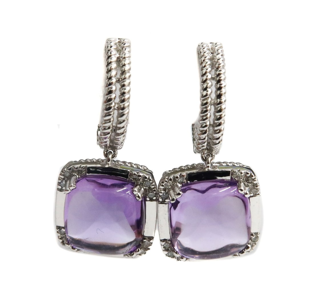 14k White Gold Cabochon Amethyst and Diamond Earrings: 14k White Gold Cabochon Cut Amethyst and Diamond Earrings. Amethysts measuring approximately 10.2 mm x 10.2 mm x 5.2 mm. 12 round cut diamonds to each earring weighing approximately 0.19 carats total.