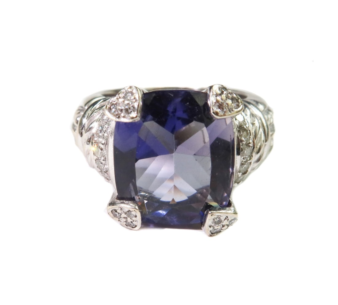 Judith Ripka 18k White Gold Diamond and Iolite Heart Pronged Ring Size 6: Judith Ripka 18k white gold diamond and Iolite heart pronged ring, size 6. Cushion cut Iolite center measuring 14mm x 12mm x 6.6mm and weighing roughly 6.67 carats. White gold band with round cut diam