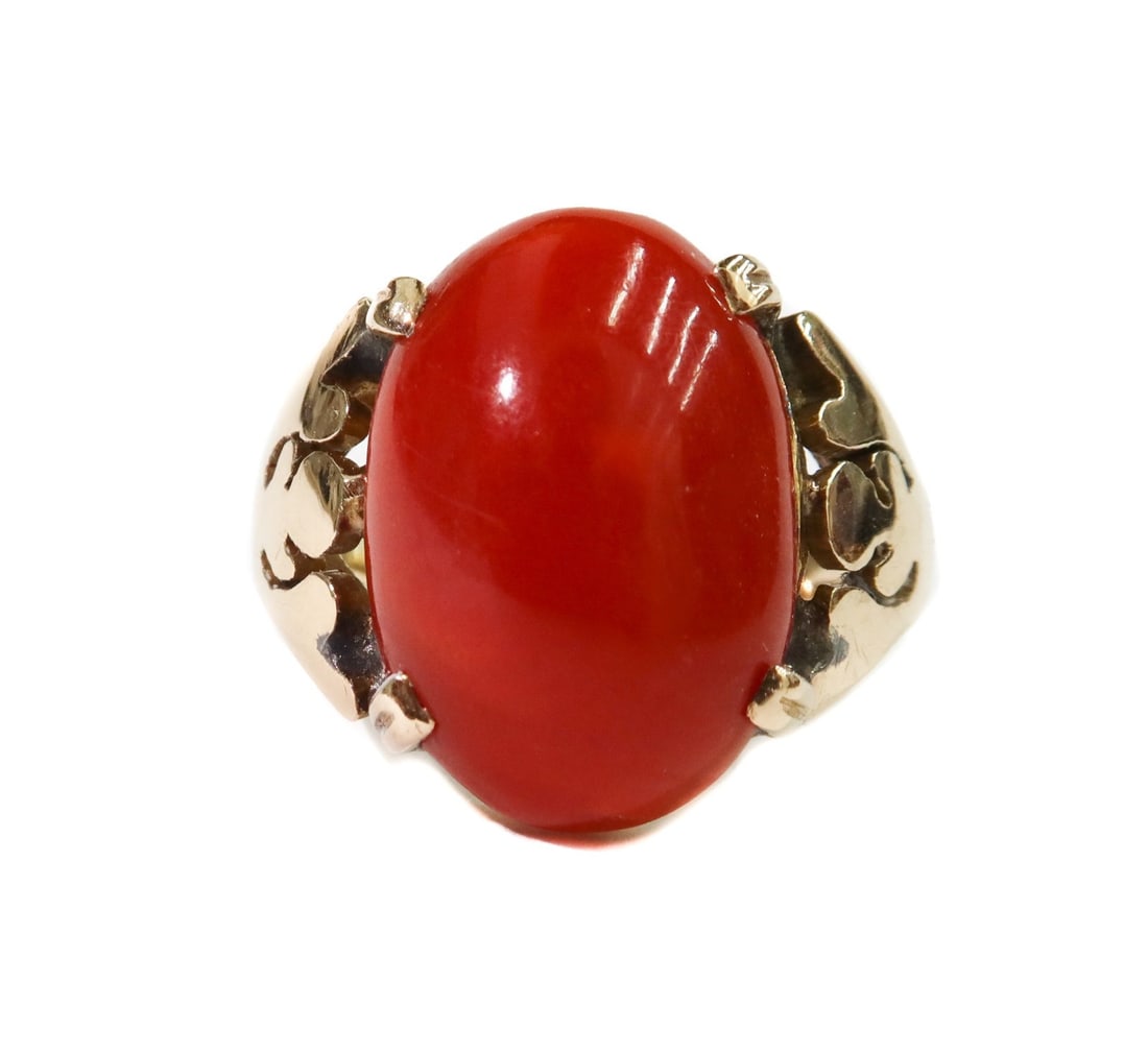 Ming's 14k Yellow Gold Red Coral Cabochon Ring Size 5: Ming's 14k yellow gold red coral cabochon ring, size 5. Cabochon red coral center measuring approximately 17mm x 11.7mm x 5.8mm. Marked Ming's to interior. Tests for 14k gold. Weight: Approx. 6.18 gra