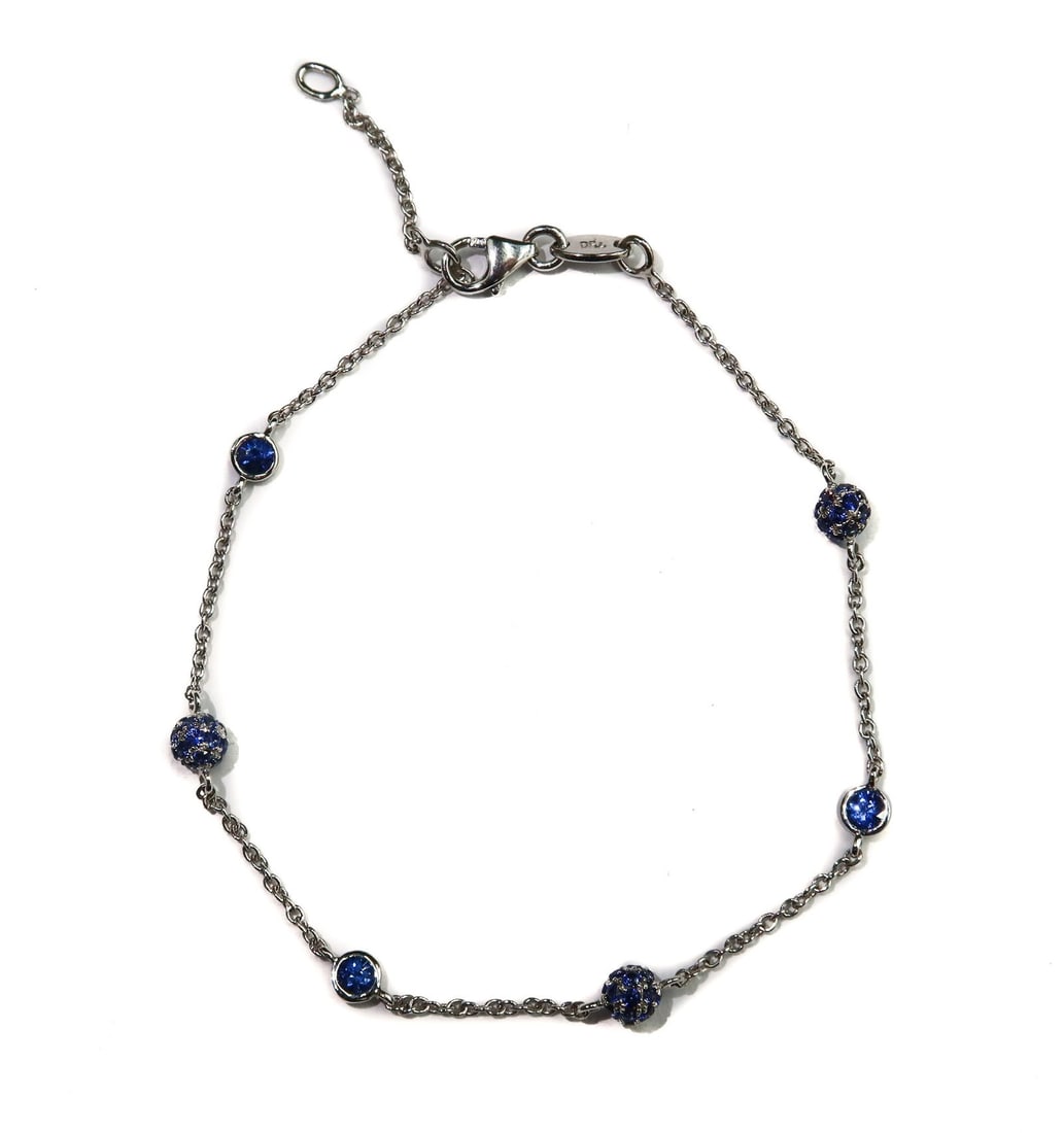 Alex Jona Italian Blue Sapphire 18k White Gold Bracelet: Alex Jona Italian 18k White Gold Blue Sapphire Bracelet. Sapphire cluster balls alternating with round cut sapphires. The sapphires weighing approximately 0.8 carats. Marked "Jona 750" to clasp. Weigh