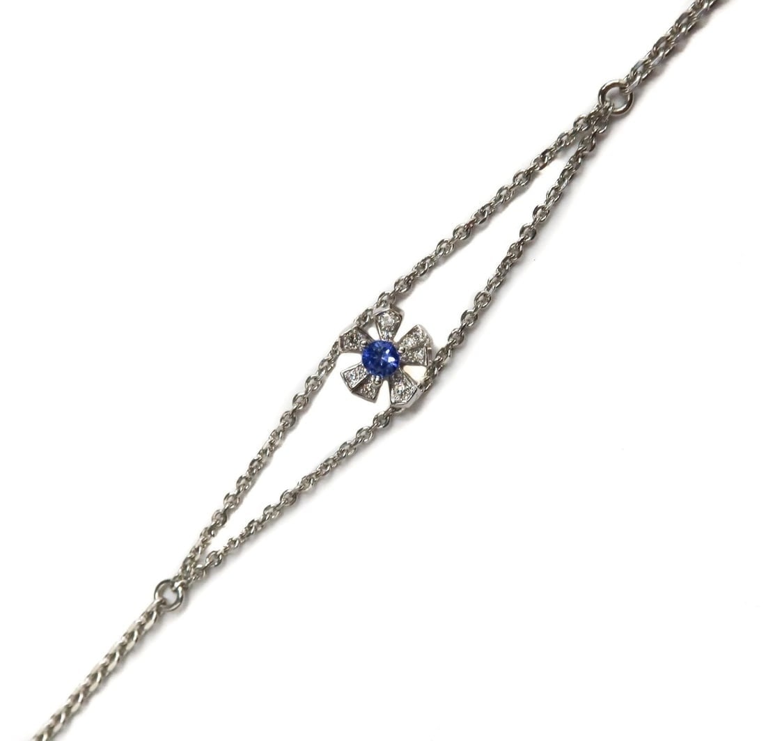 Mimi So 18k White Gold Blue Sapphire and Diamond Orchid Floral Bracelet: Mimi So 18k White Gold Blue Sapphire and Diamond Orchid Floral Bracelet. Round cut sapphire center measuring 2.9mm and weighing approximately 0.10 carats. 11 round cut diamonds to petals weighing appr