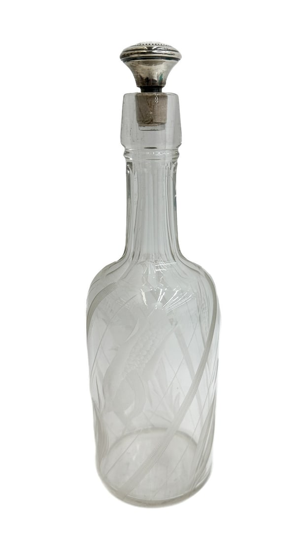 American Sterling Silver and Cut Glass Corn Decanter: American Sterling Silver and Cut Glass Corn Decanter. Etched corn throughout the exterior. Marked Sterling to the stopper. Weight: Approx. 1 lbs Measurements: Approx. 3.5 inches diameter x 11 inches t