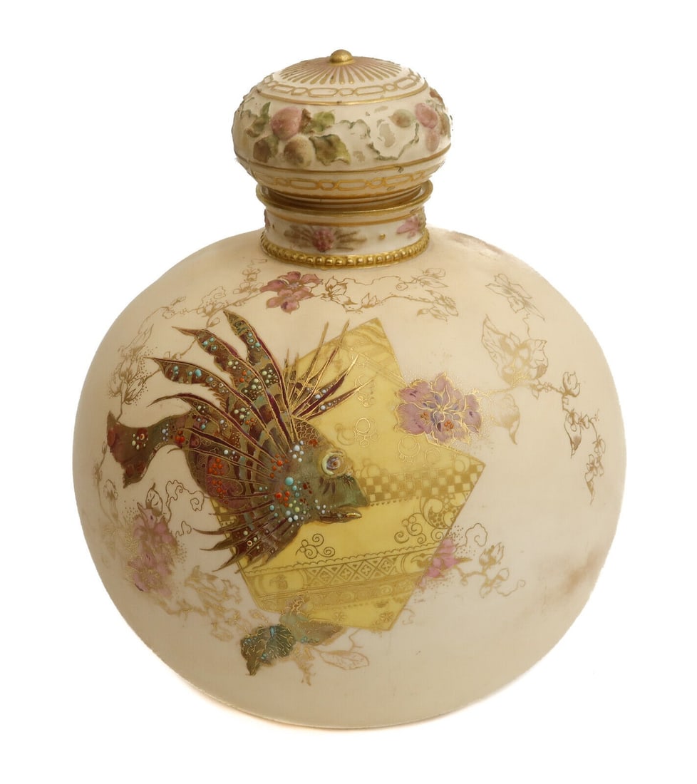 Royal Crown Derby England Porcelain Round Lidded Urn, 1891. Lionfish and Enamel: Royal Crown Derby England porcelain round lidded urn, 1891. Peach ground with figural lionfish to center and multi-color enamel dots throughout. Royal Crown Derby to underside dating to 1891. Approxim