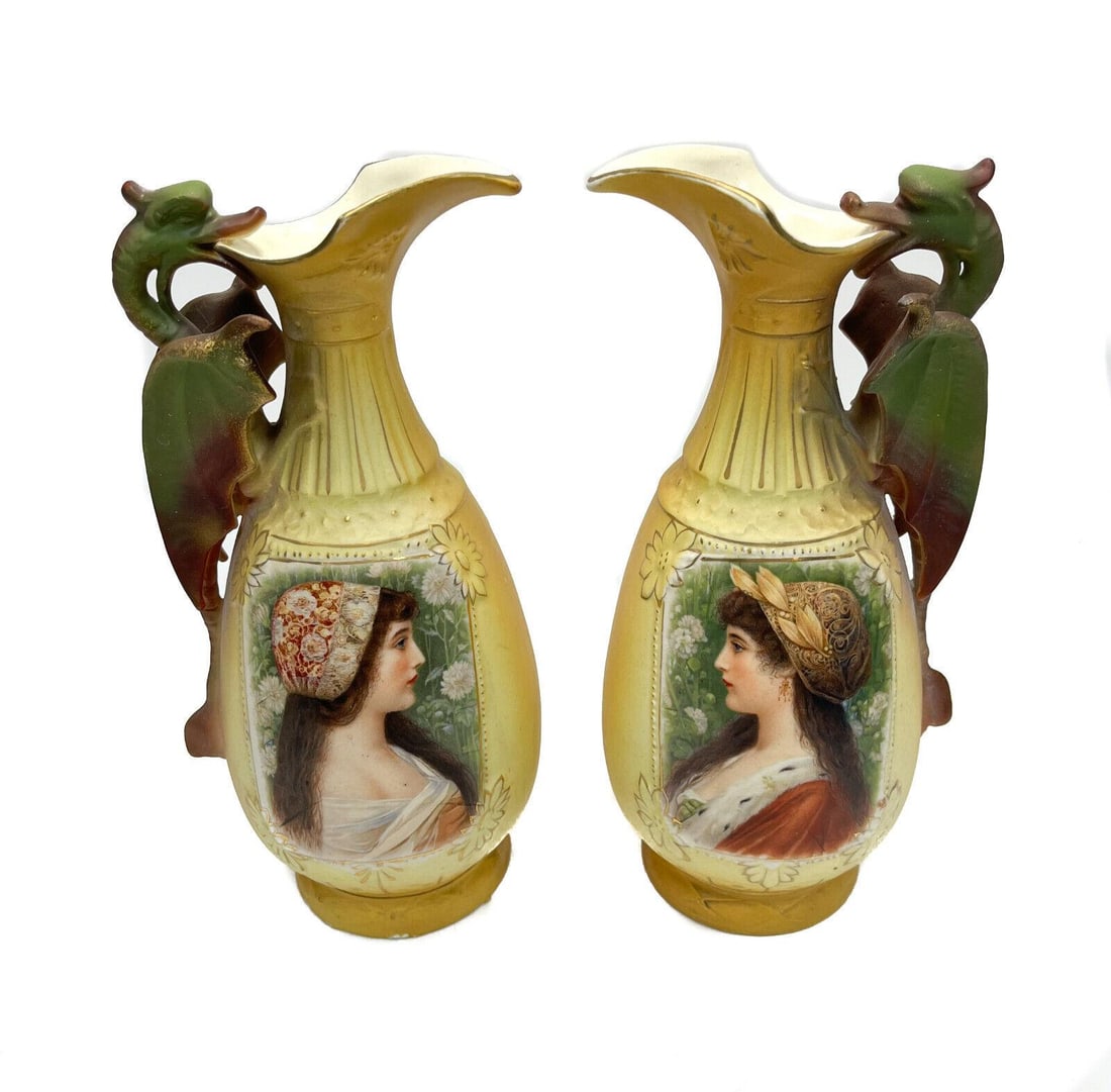 Pair Royal Wettina Austria Porcelain Pitchers, circa 1900: Pair Royal Wettina Austria porcelain pitchers, circa 1900. The central area depicts two period era beauties. Royal Wettina mark to the underside. Weight Approx., 2 lbs Measures Approx., 5 inches x 4.5
