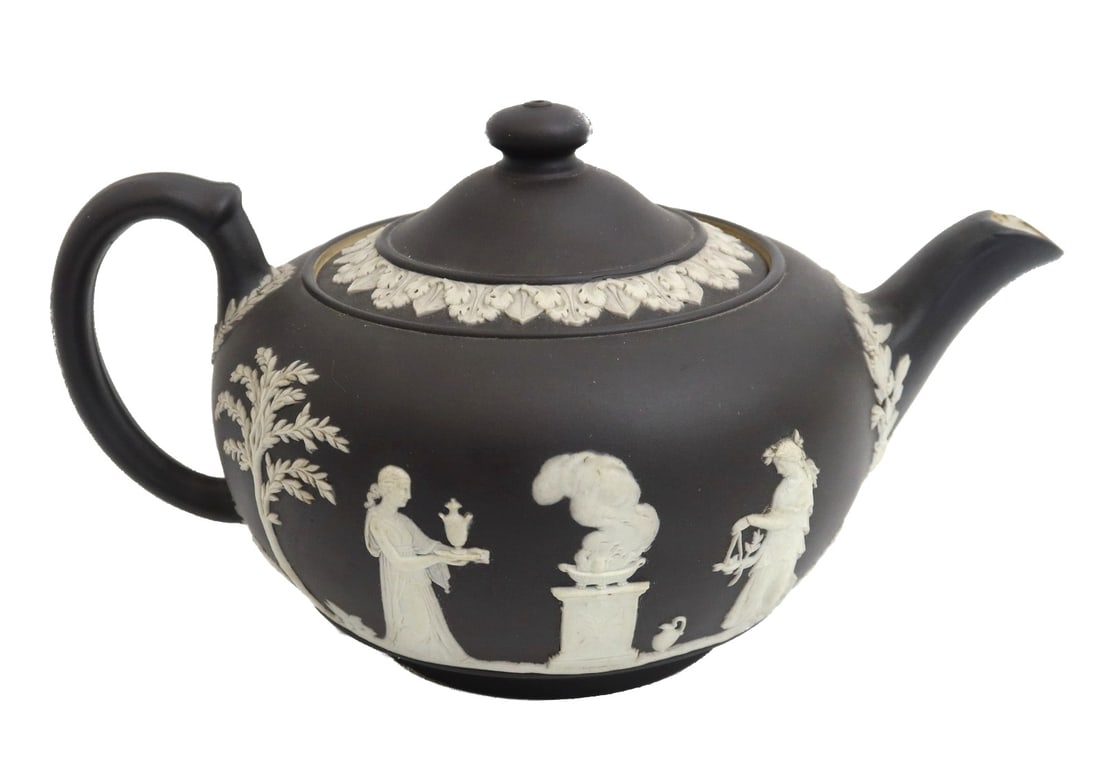 Wedgwood England Black Dipped Jasperware Figural Teapot 1905: Wedgwood England black dipped jasperware figural teapot, 1905. Black jasperware with white relief classical figures throughout. Wedgwood England mark to underside with impressed "H" mark for 1905. Wei