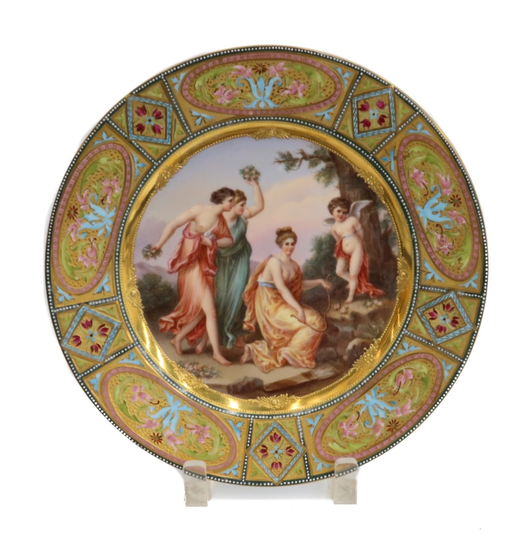 Royal Vienna Austria Hand Painted Porcelain Portrait Plate Punished Cupid c1900: Royal Vienna Austria hand painted porcelain portrait plate, Bestrafter Amor (Punished Cupid), circa 1900. The portrait depicts three dancing women and a Cupid tied to a tree. Dark green, blue and gold