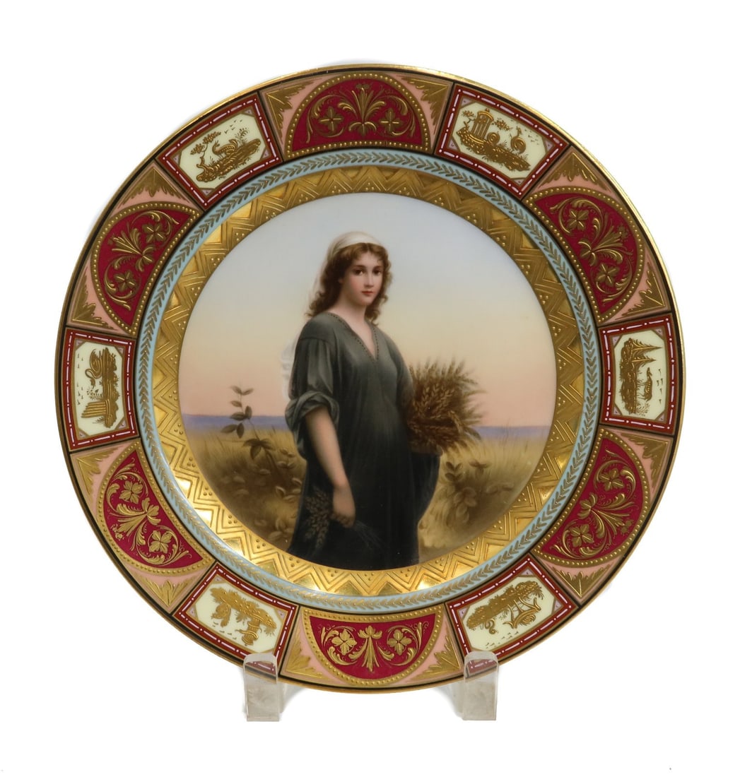 Royal Vienna Austria Hand Painted Porcelain Portrait Plate Ruth circa 1900: Royal Vienna Austria hand painted porcelain portrait plate, Ruth, circa 1900. The portrait depicts Biblical figure, Ruth, holding hay. Maroon red and yellow ground with gold encrusted designs to rim. 