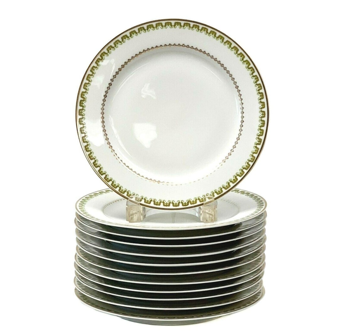 12 Haviland Limoges France Gilt Porcelain Dessert Plates Green Decoration c.1900: 12 Haviland Limoges France porcelain dessert plates, circa 1900. A white ground with green and gilt geometric and floral decoration to the edges. A band of gilt geometric design to the center edge, gi