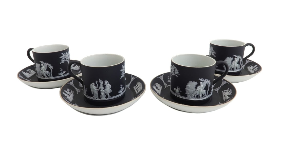4 Wedgwood England Black Dipped Jasperware Cup and Saucers circa 1925: 4 Wedgwood England black dipped jasperware figural cup and saucers, circa 1925. Black jasperware with white relief classical figures throughout. Wedgwood England mark to underside. Weight: Approx. 1 l
