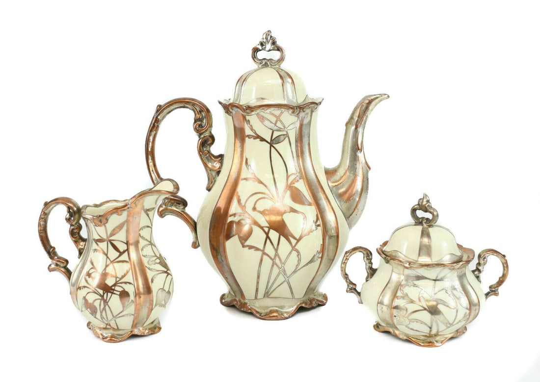 3pc Hertel Jacob Bavaria Germany Silver on Copper Porcelain Feet Coffee Pot: 3pc Hertel Jacob Bavaria Germany Silver on Copper Overlay Porcelain Footed Coffee Pot, Cream & Sugar Set, c1930 - Elegant bird and branch pattern. Measures approximately, pot 10.5 inches height x 8.5 