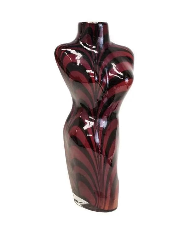 Italian Art Glass Female Torso Vase: Art glass vase in the shape of the female torso. Maroon and black swirl stripes throughout. Manner of Leonard Rosen. Weight Approx., 4.5 lbs Measures approx., 6.5 inches x 4.75 inches x 13.5 inches