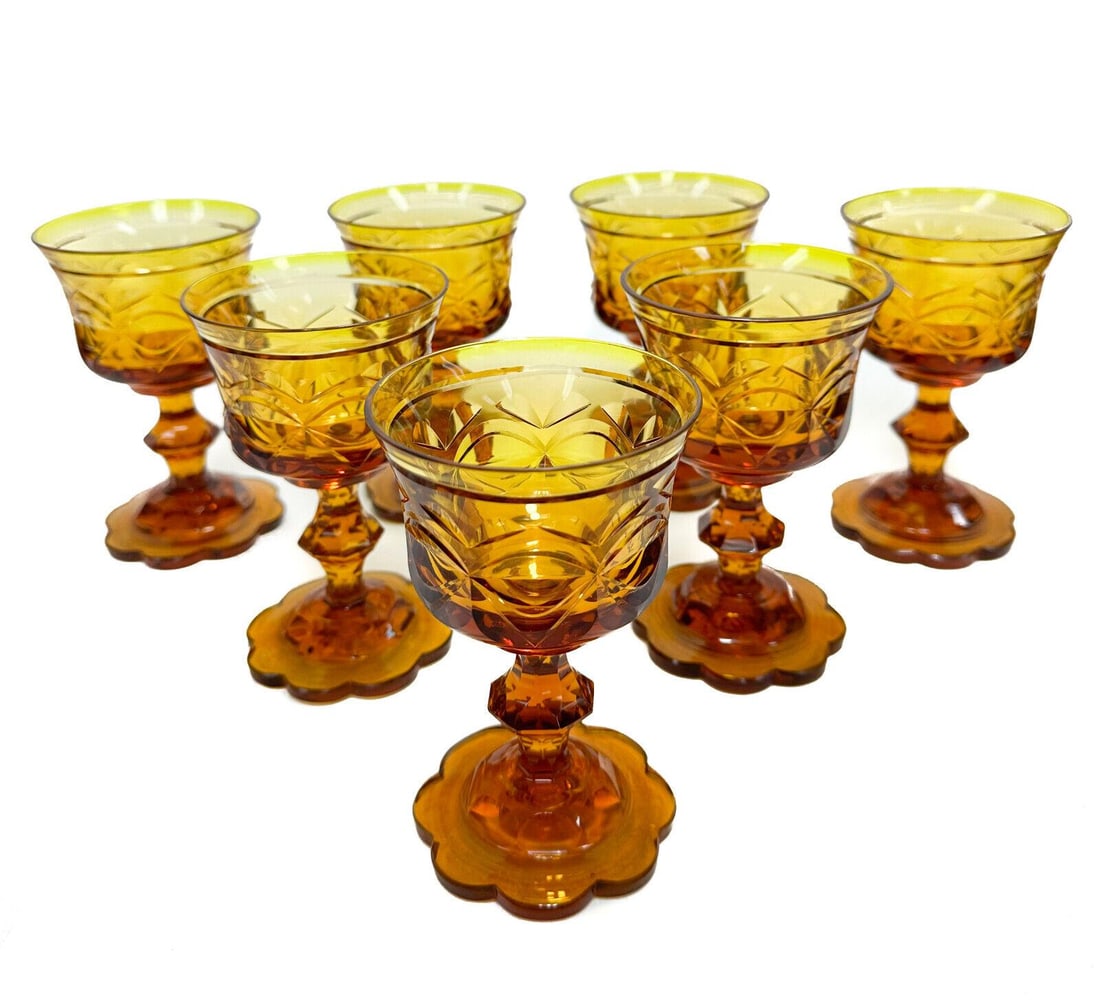 7 Bohemian Amber Gold Cut Glass 5 ounce Wine Goblets, 19th Century: 7 Bohemian amber gold cut glass 5 ounce wine goblets, 19th Century. Bisected oval motif with a scalloped petal base. Pontil underside. Weight Approx., 4 lbs Measures Approx., 3.1 inches diameter x 5